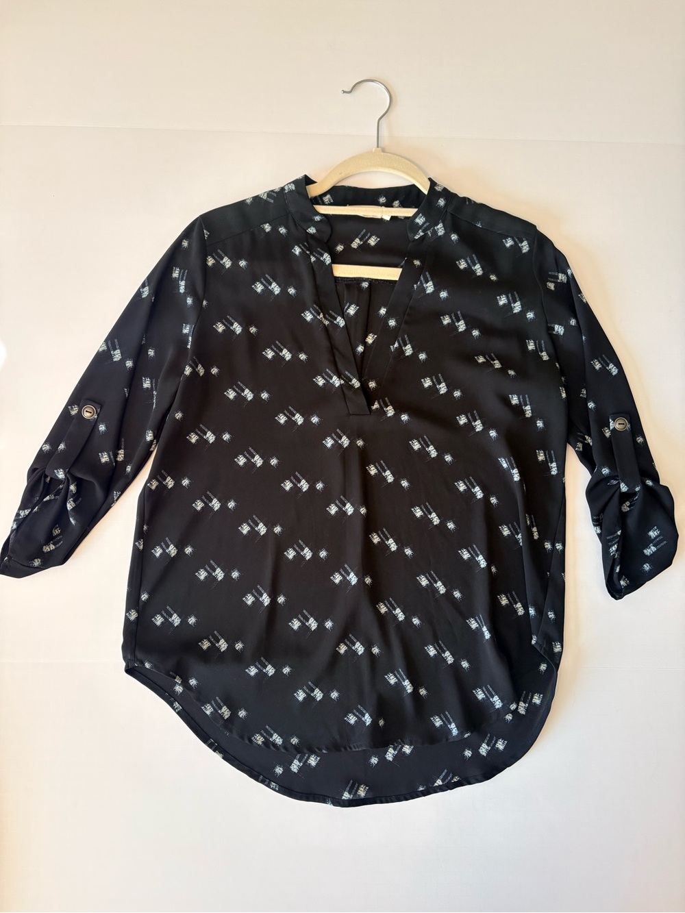 Kacey Montoya’s Closet | Lush Black Geometric White & Blue Print Roll-Tab Top